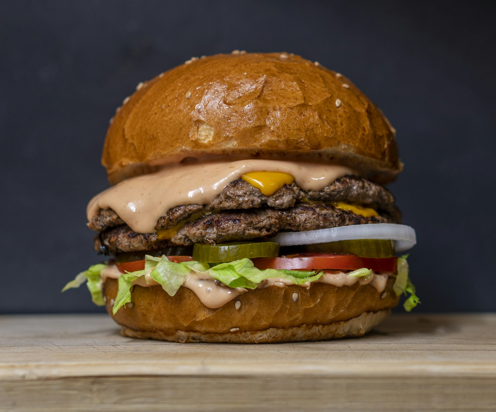 Illustrative photograph of a generous burger with lettuce and cheese